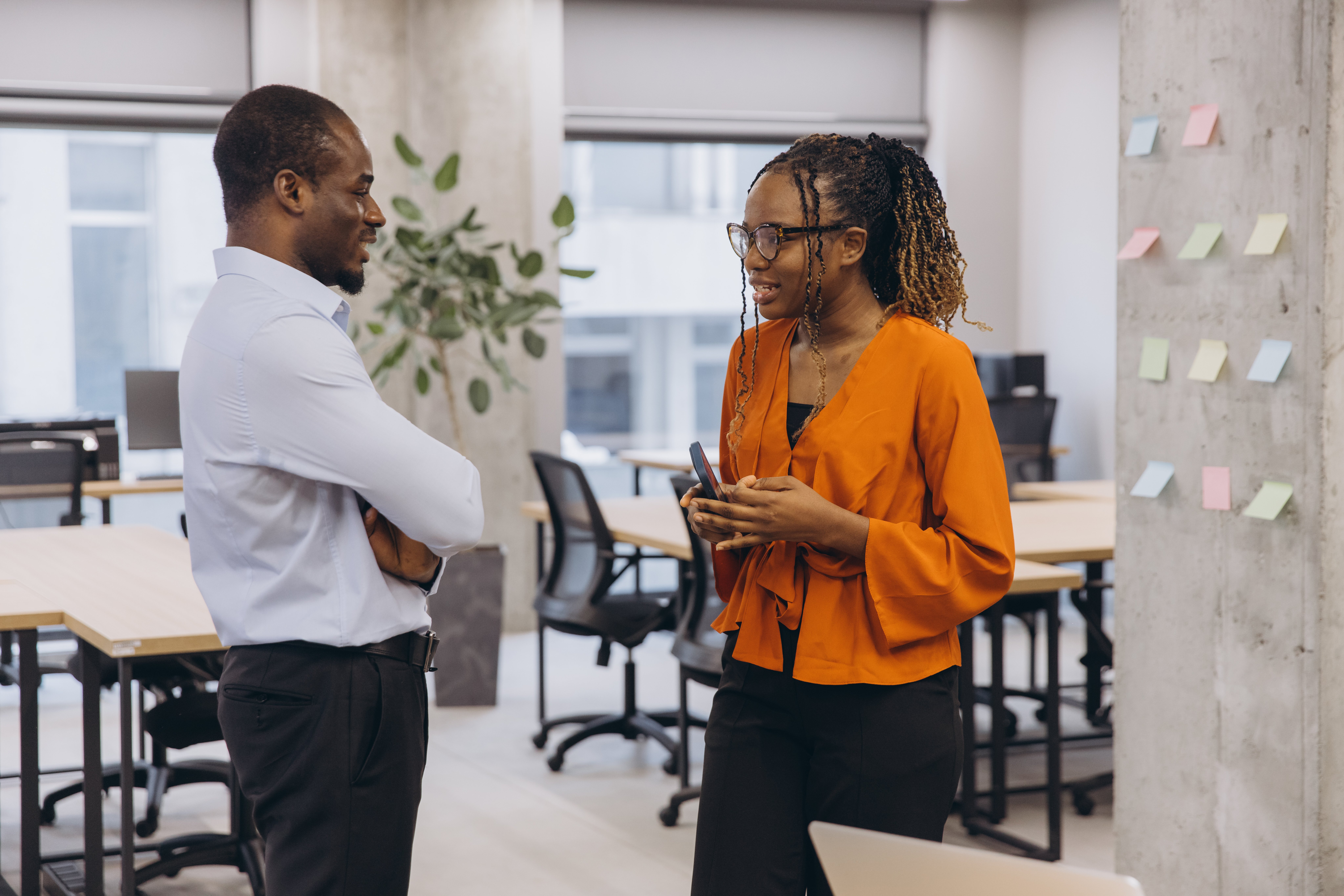 coworkers-discuss-business-in-bright-modern-office-2026-03-18-21-50-35-utc
